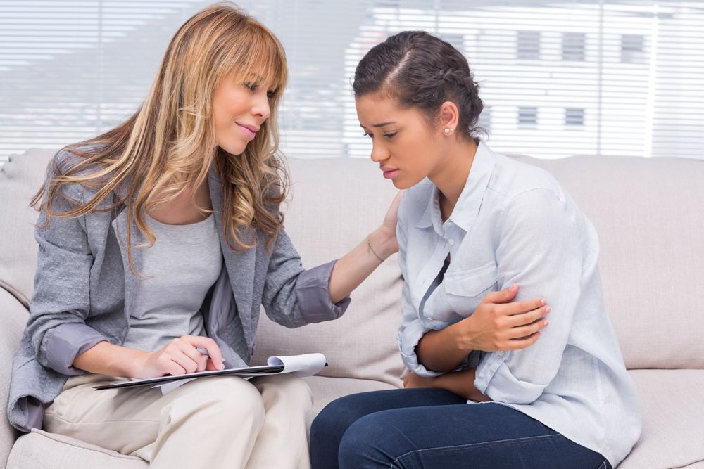 Psychotherapist helping a patient at office